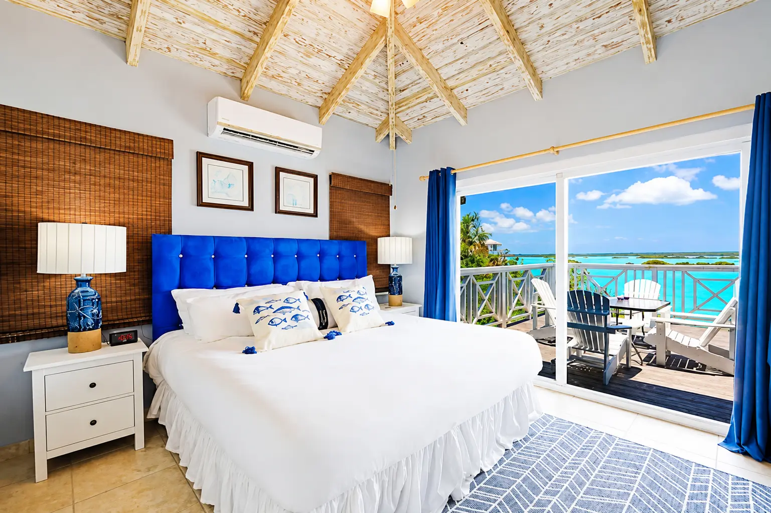 Bedroom with large bed and balcony
